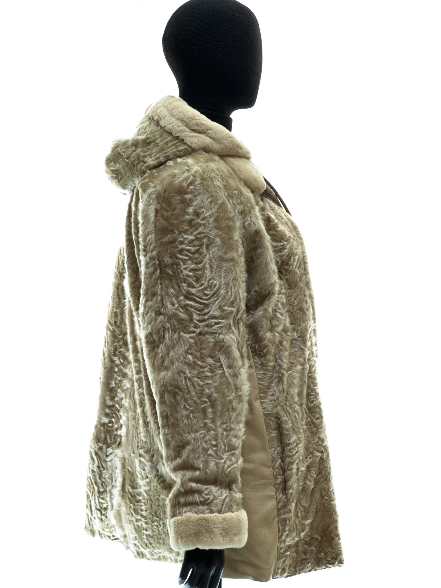 Sand-colored lamb coat with sheared mink trim, reversible design, detachable hood, and waterproof stone-colored fabric