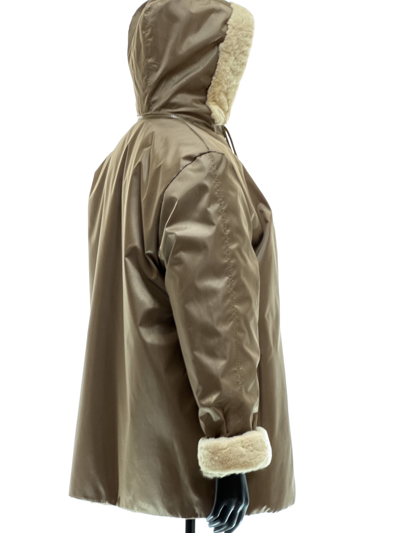 Sand-colored lamb coat with sheared mink trim, reversible design, detachable hood, and waterproof stone-colored fabric